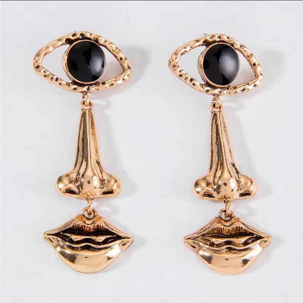 Gold and Black Eye Earrings Face